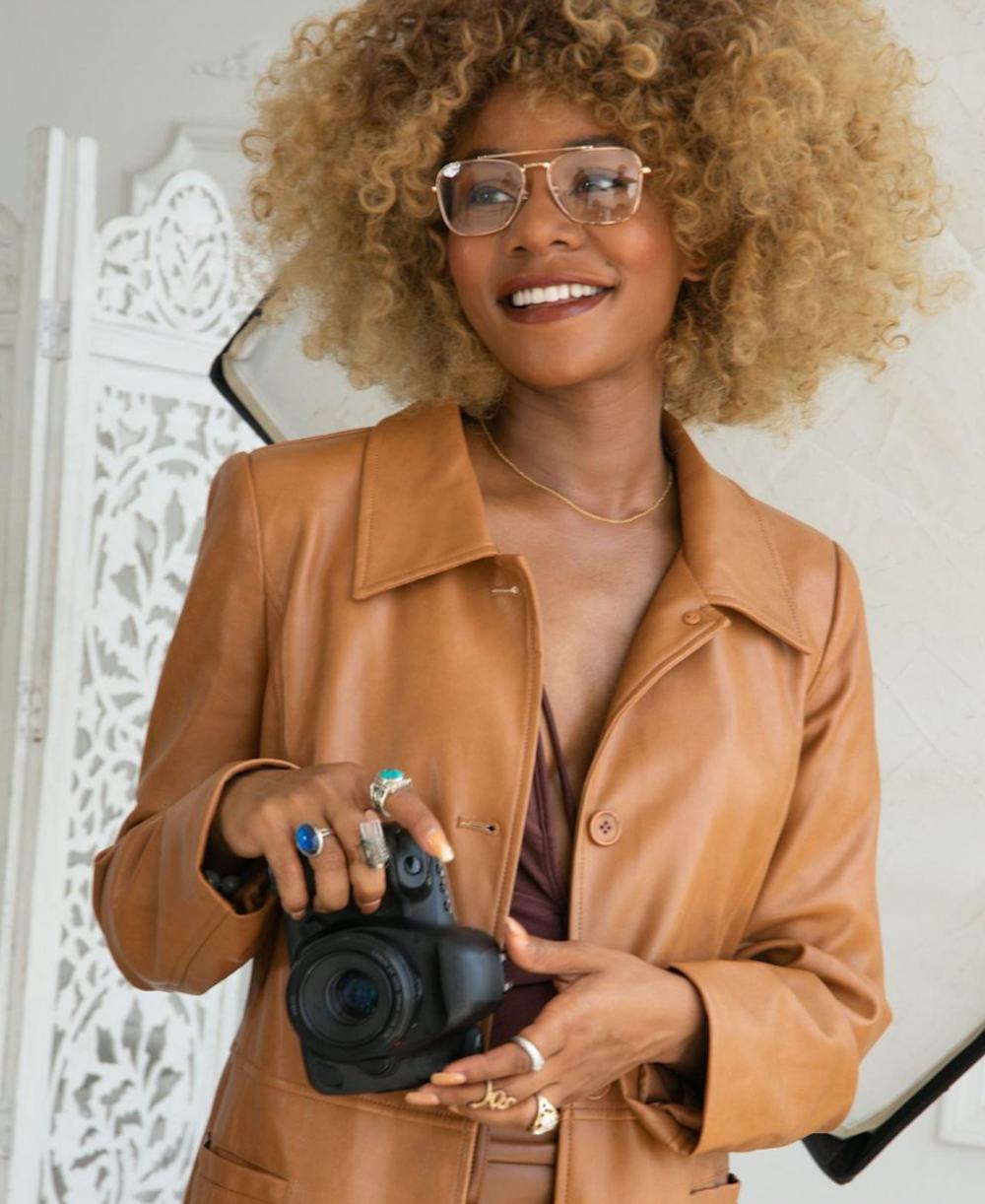 women with glasses and camera