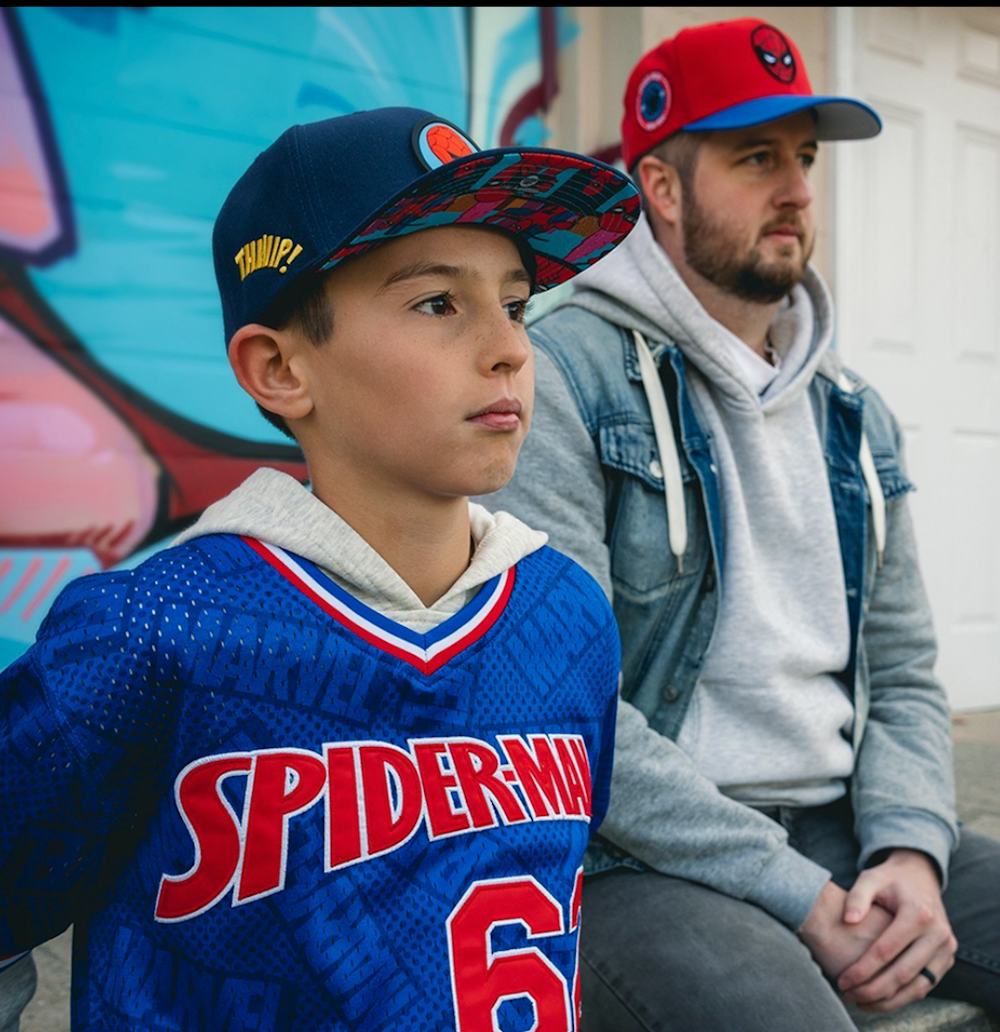 Man and boy in Spiderman hats 