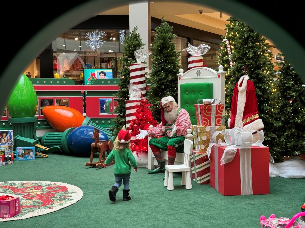 Santa and child in toyland